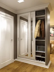 Built-In Wardrobe In The Hallway In Light Colors Photo