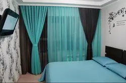 One curtain in the bedroom interior photo