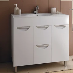 Washbasin in the bathroom with cabinet photo