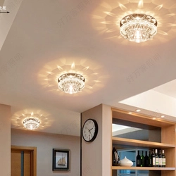 Suspended ceiling with spotlights and chandelier in the living room photo