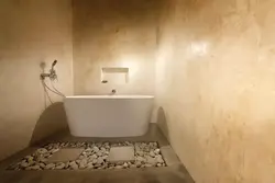 Photo of finishing a bathroom with decorative plaster