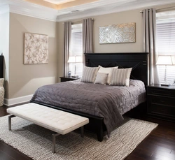 Photo of a bedroom with dark furniture in a modern style