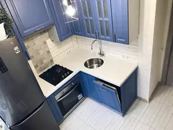 Small kitchen layout photo with refrigerator