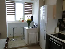 Kitchen interior photo in a panel house with a balcony