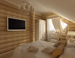 Bedroom interior of a wooden house made of logs