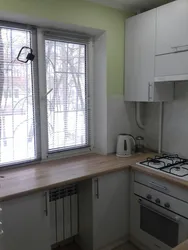 Interior of a small kitchen 5 sq m with a gas water heater