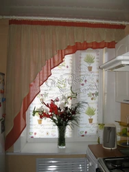 One curtain in the kitchen in the interior