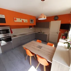 Color combination with orange in the kitchen interior photo