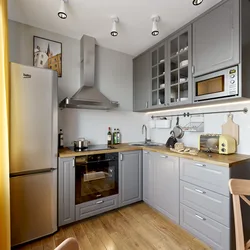 Photo of a small corner kitchen with appliances