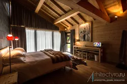 Bedroom in a log house photo