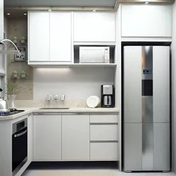 Refrigerator in the middle of the kitchen photo