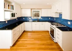 White kitchen with blue apron photo