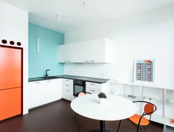 Kitchen design with orange refrigerator