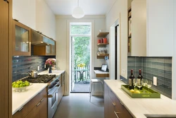 Narrow kitchen design with window at end and door