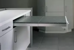 Ошхонаҳо бо мизи кашолашаванда аз зери акси countertop