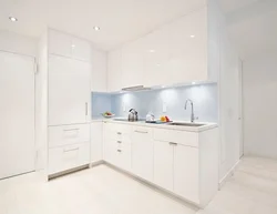 White kitchen up to the ceiling in the interior photo