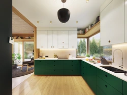 Зеленая кухня с деревянной столешницей в интерьере