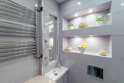 Bathroom design with shelves in the wall