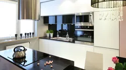 Kitchen design with black countertop and splashback