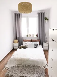 Interior design of a small bedroom with a bed