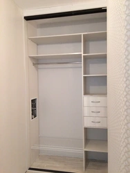 Built-in wardrobe in a niche in the hallway photo