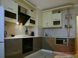 Kitchen design in a panel house with a ventilation duct
