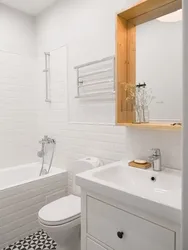 Small bathroom design with white tiles