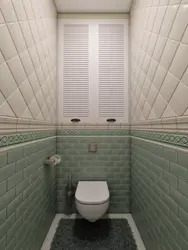 Photo of a toilet in an apartment tile design