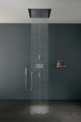 Photo of a bathtub with a rain shower
