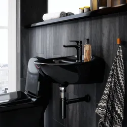 Bathroom with black faucets photo