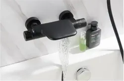 Bathroom with black faucets photo