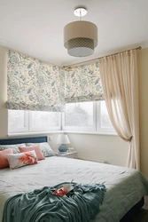 Roman blinds in a modern bedroom interior