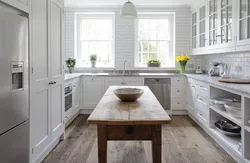 White kitchen and wooden table photo