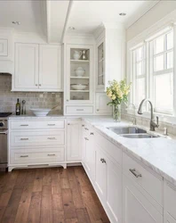 Photo of a kitchen with a window in light colors