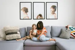 Family photos on the living room wall