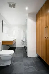 Bath design dark floor light walls