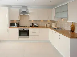 White kitchen with wooden countertops, real photos