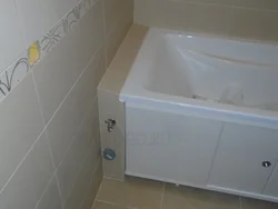 Box in the bathroom covers the pipes photo