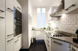 Small narrow kitchen design photo with refrigerator