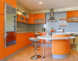 Kitchen In Orange-Gray Tones Photo