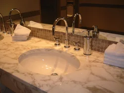 Countertop made of artificial stone in the bathroom photo