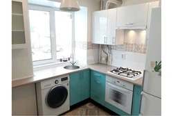 Interior of a small kitchen with a washing machine