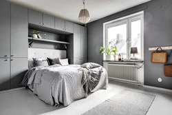 Bedroom design with gray bed and wardrobe