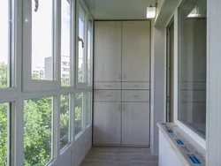 Design of windows on the balcony in the apartment photo