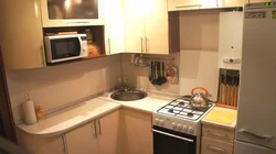 Design of a small kitchen photo sq m with a refrigerator