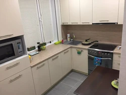 Design of a small kitchen photo sq m with a refrigerator