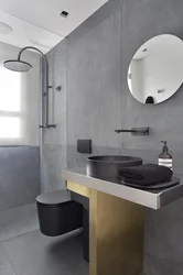 Bathroom with black sink photo
