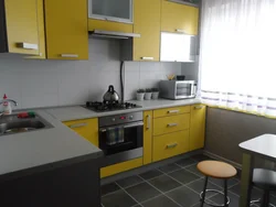 Gray-yellow kitchen design photo