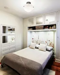 Small white bedroom interior photo