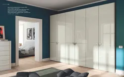Built-in wardrobe with hinged doors in the bedroom photo